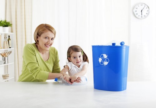 User loading waste into a secure skip container